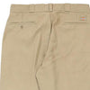 Dickies Trousers - 36W 29L Khaki Polyester Blend - Thrifted.com